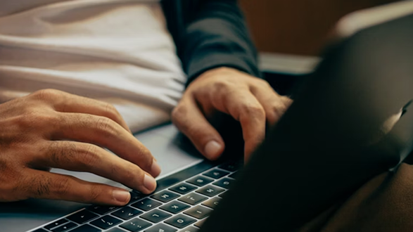 Person typing on a laptop